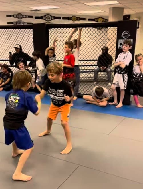 Coach Gabriel with kids photo